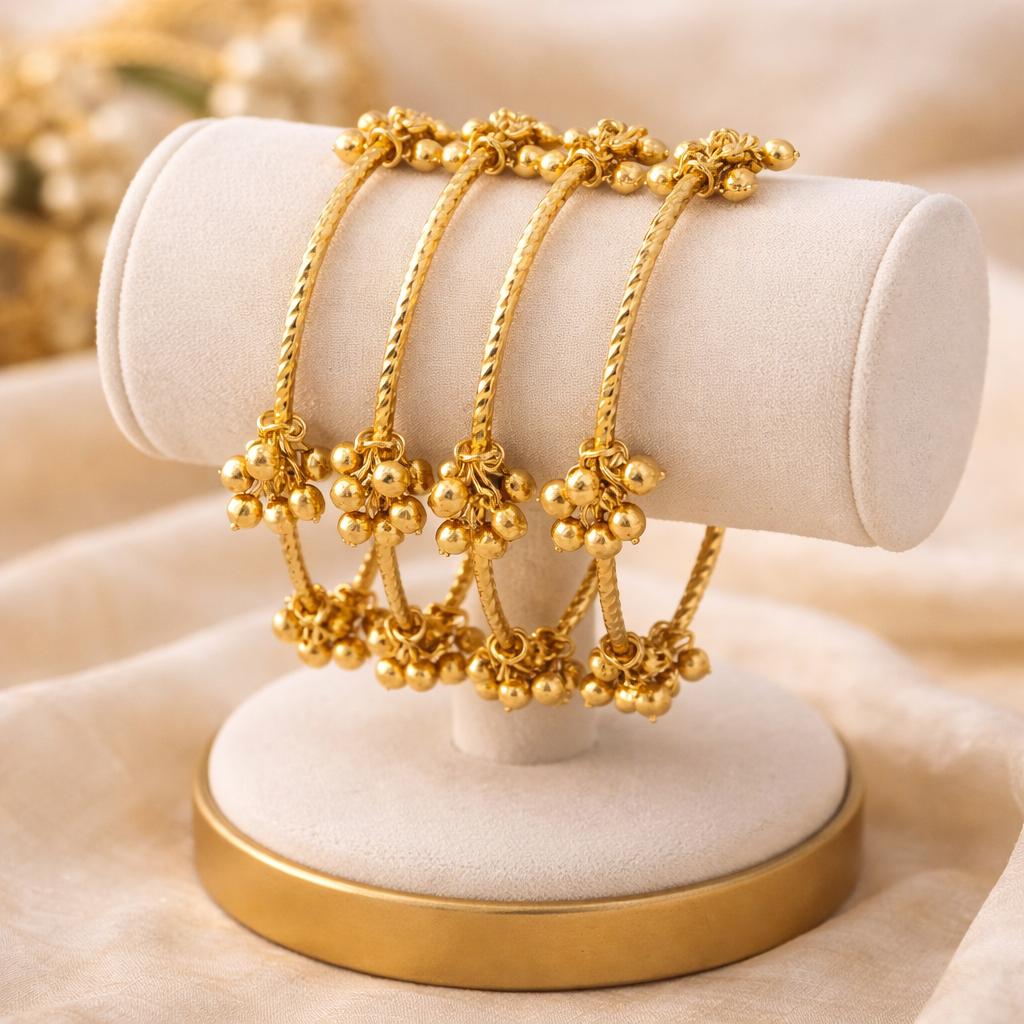 Set of 4 Gold-Plated Twisted Kashmiri Bangles with Ghunghroo Charms
