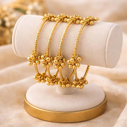 Set of 4 Gold-Plated Twisted Kashmiri Bangles with Ghunghroo Charms
