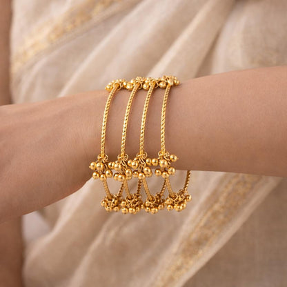 Set of 4 Gold-Plated Twisted Kashmiri Bangles with Ghunghroo Charms
