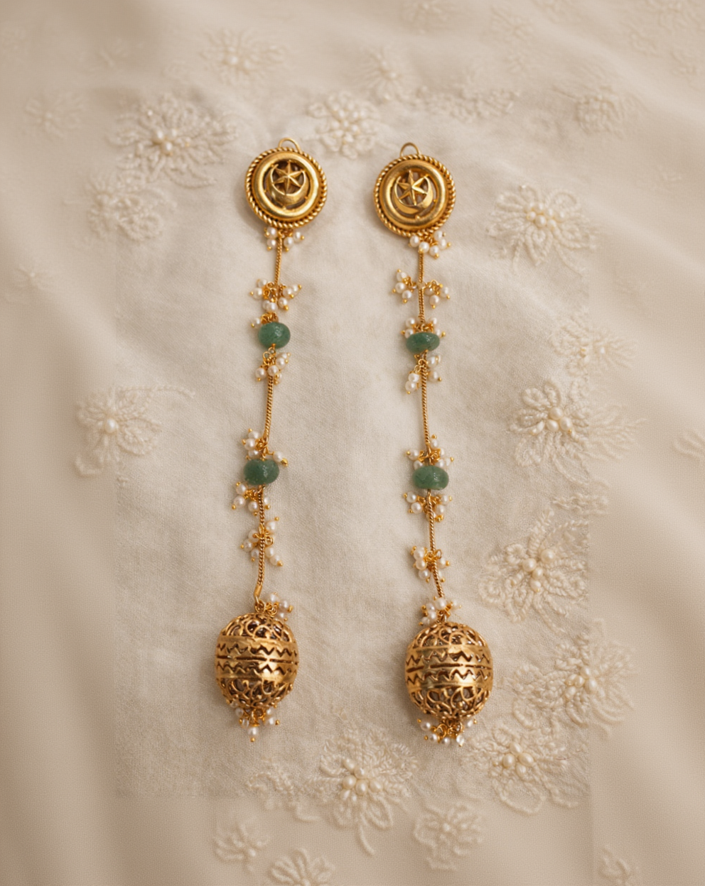 Ornate Gold Jhumka Earrings with Green Emerald Drops and Pearl Accents-G352400